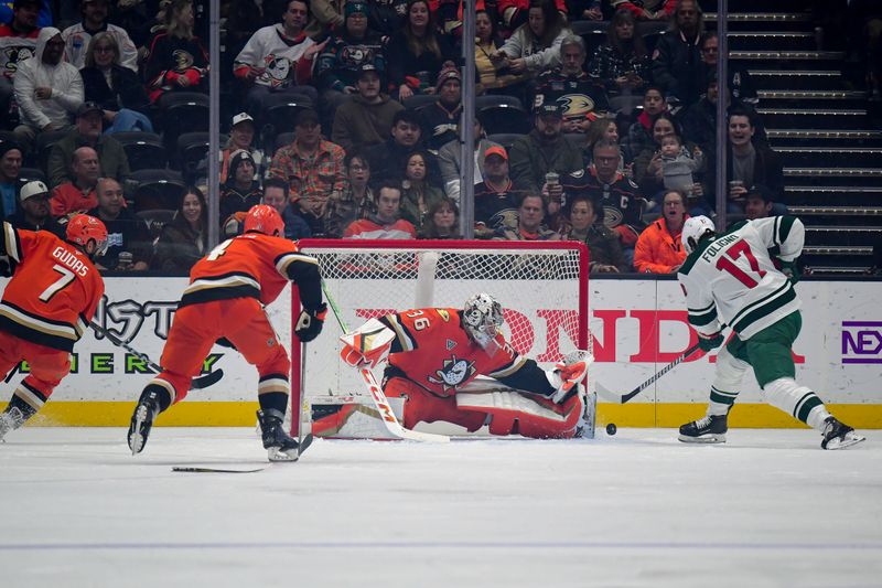 Dec 6, 2024; Anaheim, California, USA; Minnesota Wild left wing Marcus Foligno (17) shoots against Anaheim Ducks goaltender John Gibson (36) during the second period at Honda Center. Mandatory Credit: Gary A. Vasquez-Imagn Images