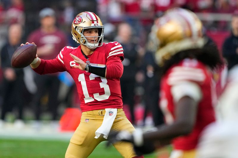 San Francisco 49ers quarterback Brock Purdy passes against the Arizona Cardinals during the first half of an NFL football game Sunday, Dec. 17, 2023, in Glendale, Ariz. (AP Photo/Matt York)