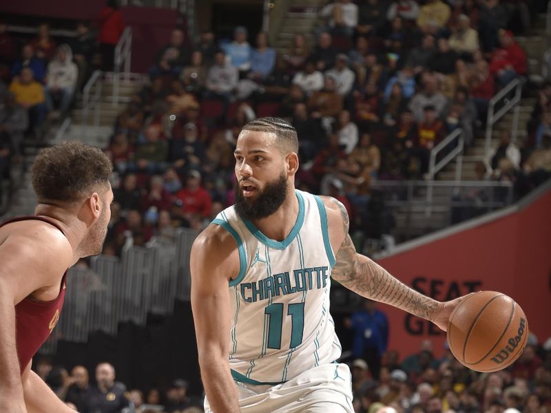 CLEVELAND, OH - JANUARY 5: Cody Martin #11 of the Charlotte Hornets handles the ball during the game against the Cleveland Cavaliers on January 5, 2025 at Rocket Mortgage FieldHouse in Cleveland, Ohio. NOTE TO USER: User expressly acknowledges and agrees that, by downloading and/or using this Photograph, user is consenting to the terms and conditions of the Getty Images License Agreement. Mandatory Copyright Notice: Copyright 2025 NBAE (Photo by David Liam Kyle/NBAE via Getty Images)