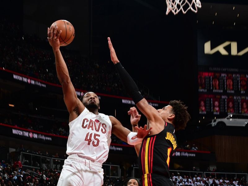 ATLANTA, GA - JANUARY 20: Donovan Mitchell #45 of the Cleveland Cavaliers drives to the basket during the game against the Atlanta Hawks/ on January 20, 2024 at State Farm Arena in Atlanta, Georgia.  NOTE TO USER: User expressly acknowledges and agrees that, by downloading and/or using this Photograph, user is consenting to the terms and conditions of the Getty Images License Agreement. Mandatory Copyright Notice: Copyright 2024 NBAE (Photo by Scott Cunningham/NBAE via Getty Images)