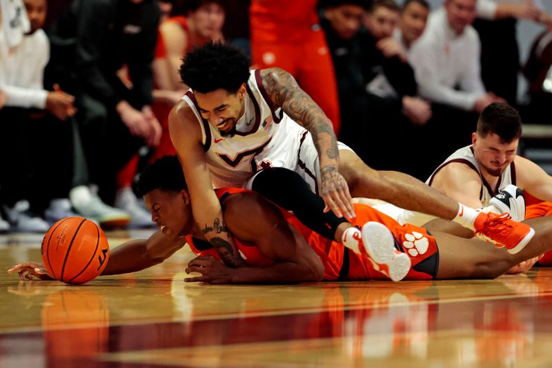 Jan 10, 2024; Blacksburg, Virginia, USA; Virginia Tech Hokies forward Mekhi Long (4) fouls Clemson Tigers forward RJ Godfrey (10) while going for a loose ball during the first half at Cassell Coliseum. Mandatory Credit: Peter Casey-USA TODAY Sports