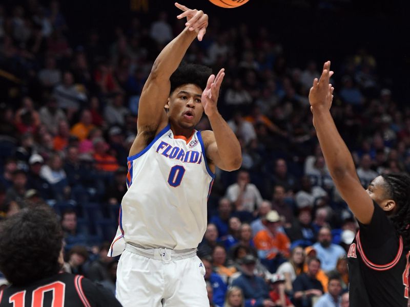 Mar 14, 2024; Nashville, TN, USA; Florida Gators guard Zyon Pullin (0) passes the ball during the first half against the Georgia Bulldogs at Bridgestone Arena. Mandatory Credit: Christopher Hanewinckel-USA TODAY Sports