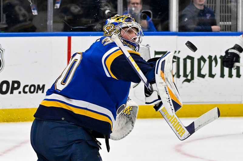 Jan 9, 2024; St. Louis, Missouri, USA;  St. Louis Blues goaltender Joel Hofer (30) defends the net against the Florida Panthers during the first period at Enterprise Center. Mandatory Credit: Jeff Curry-USA TODAY Sports