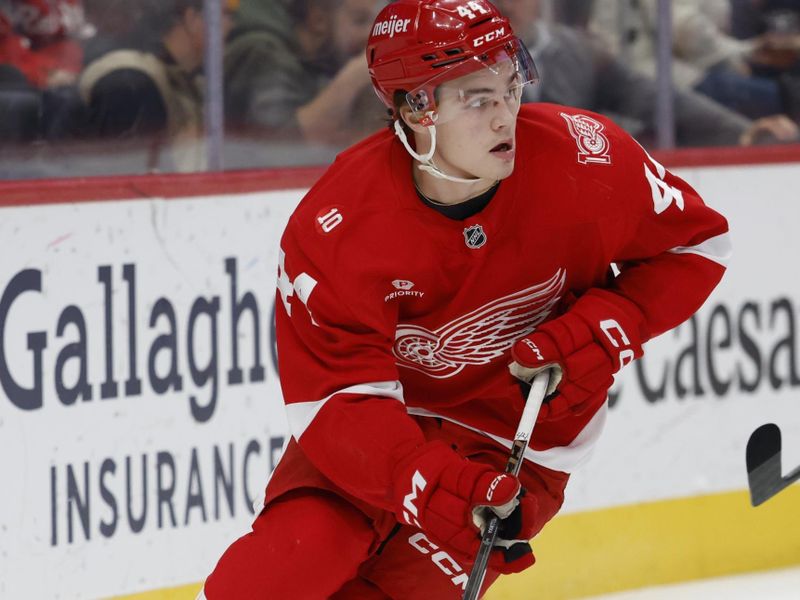 Nov 18, 2025; Detroit, Michigan, USA; Detroit Red Wings defenseman Axel Sandin-Pellikka (44) skates with the puck in the first period against the Seattle Kraken at Little Caesars Arena. Mandatory Credit: Rick Osentoski-Imagn Images