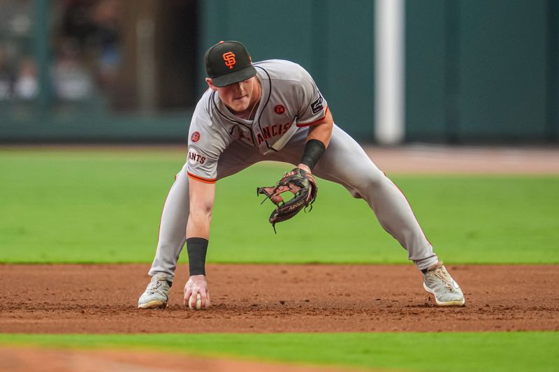 Jul 3, 2024; Cumberland, Georgia, USA; San Francisco Giants second baseman Tyler Fitzgerald (49) drops the ball but recovers in time to force out Atlanta Braves left fielder Forrest Wall (37) (not shown) during the second inning at Truist Park. Mandatory Credit: Dale Zanine-USA TODAY Sports