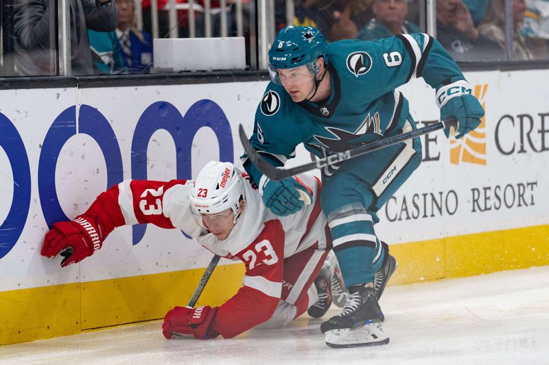 Jan 2, 2024; San Jose, California, USA; Detroit Red Wings left wing Lucas Raymond (23) and San Jose Sharks defenseman Ty Emberson (6) collide during the third period at SAP Center at San Jose. Mandatory Credit: Stan Szeto-USA TODAY Sports