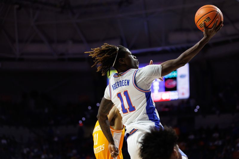 Jan 7, 2025; Gainesville, Florida, USA; Florida Gators guard Denzel Aberdeen (11) makes a layup during the second half at Exactech Arena at the Stephen C. O'Connell Center. Mandatory Credit: Matt Pendleton-Imagn Images