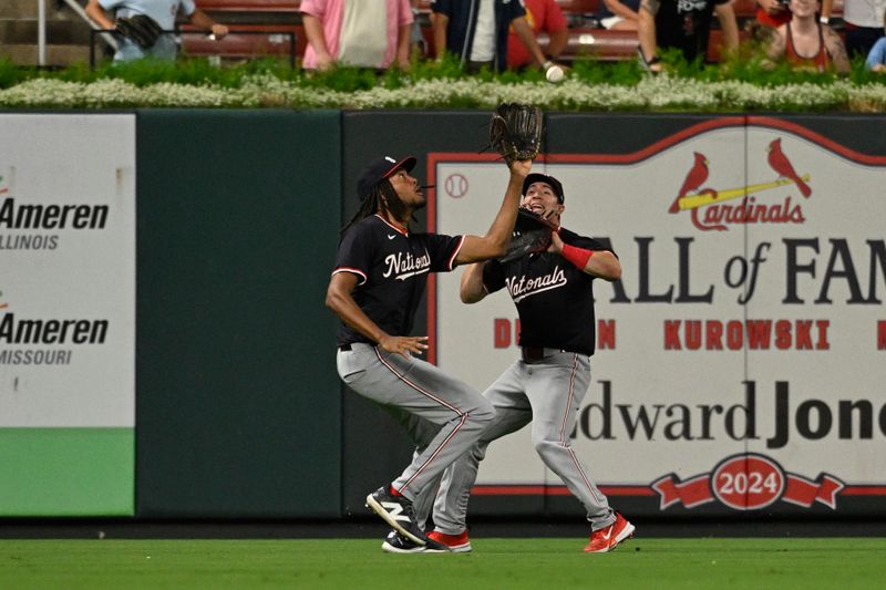 Jul 26, 2024; St. Louis, Missouri, USA; Washington Nationals right fielder James Wood (29) makes a catch in front of left fielder Lane Thomas (28) against the St. Louis Cardinals during the tenth inning at Busch Stadium. Mandatory Credit: Jeff Le-USA TODAY Sports