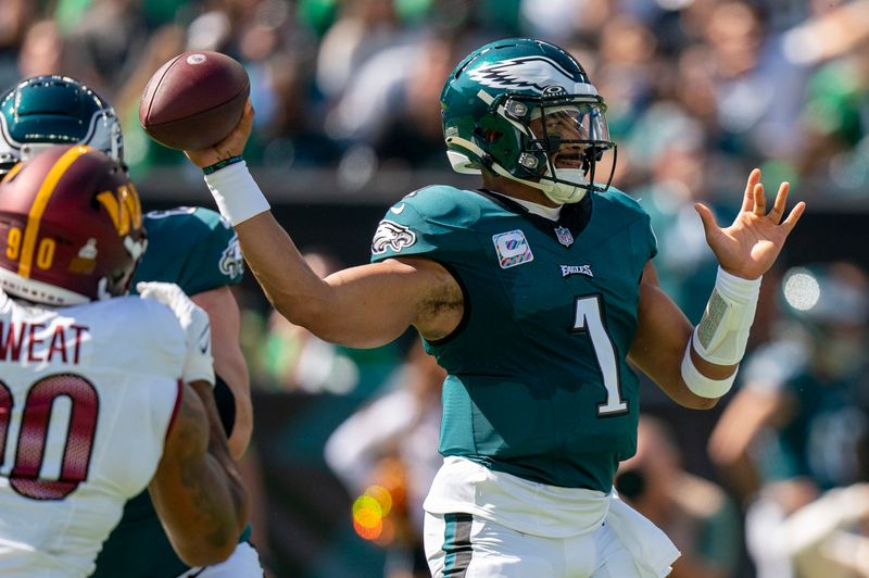 Philadelphia Eagles quarterback Jalen Hurts (1) in action during the NFL football game against the Washington Commanders, Sunday, Oct. 1, 2023, in Philadelphia. (AP Photo/Chris Szagola)