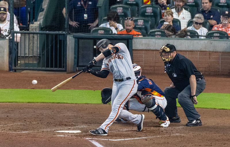 May 3, 2023; Houston, Texas, USA; San Francisco Giants center fielder Austin Slater (13) hits a RBI double against the Houston Astros in the sixth inning at Minute Maid Park. Mandatory Credit: Thomas Shea-USA TODAY Sports