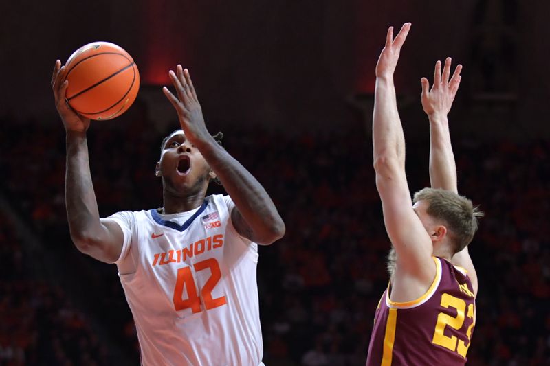 Feb 28, 2024; Champaign, Illinois, USA; Illinois Fighting Illini forward Dain Dainja (42) drives pas Minnesota Golden Gophers forward Parker Fox (23) during the first half at State Farm Center. Mandatory Credit: Ron Johnson-USA TODAY Sports