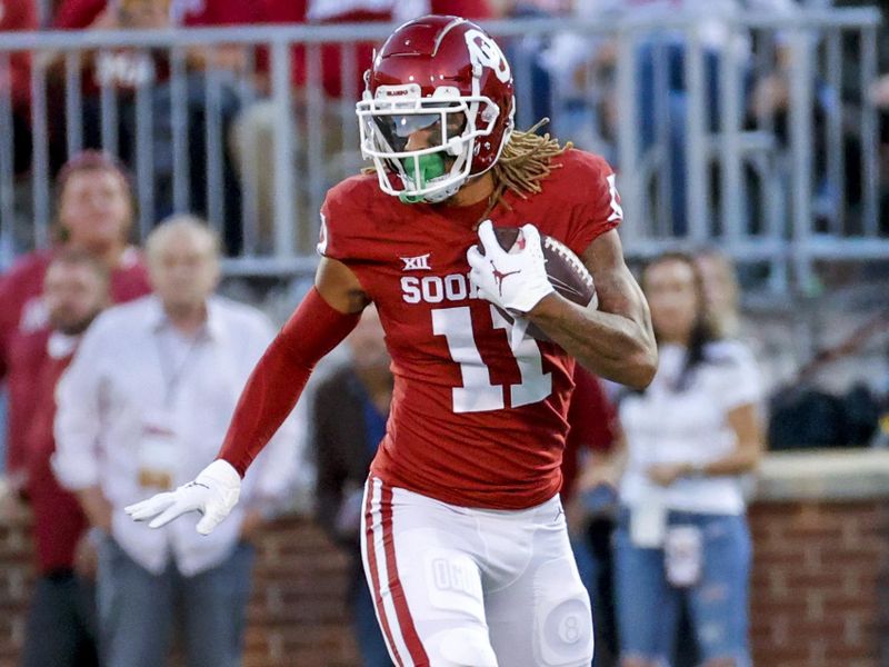 Oct 16, 2021; Norman, Oklahoma, USA; Oklahoma Sooners wide receiver Jadon Haselwood (11) runs with the ball during the game against the TCU Horned Frogs at Gaylord Family-Oklahoma Memorial Stadium. Mandatory Credit: Kevin Jairaj-USA TODAY Sports