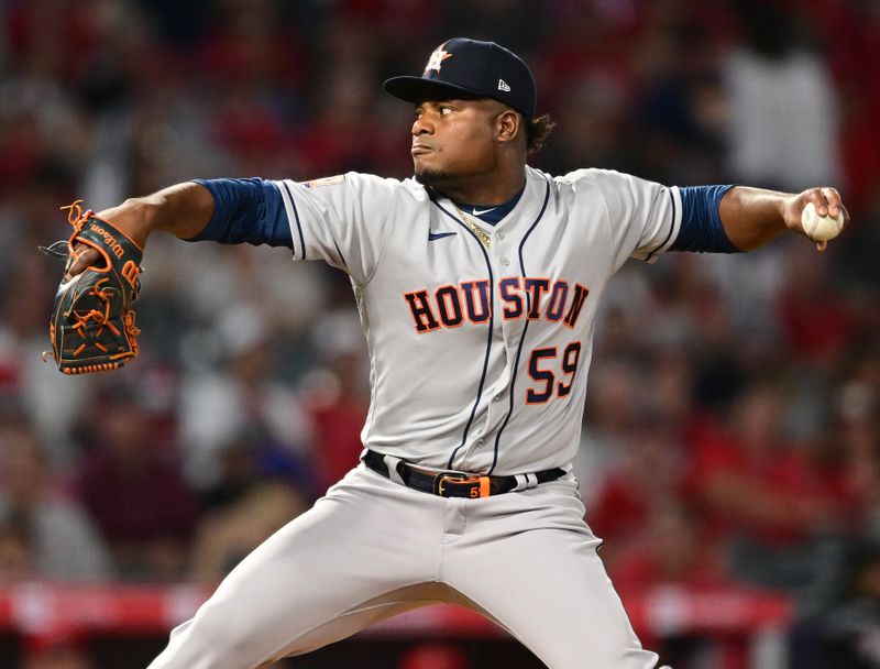 Apr 7, 2022; Anaheim, California, USA; Houston Astros starting pitcher Framber Valdez (59) throws a pitch in the second inning against the Los Angeles Angels at Angel Stadium. Mandatory Credit: Jayne Kamin-Oncea-USA TODAY Sports