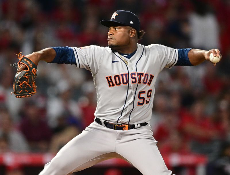 Apr 7, 2022; Anaheim, California, USA; Houston Astros starting pitcher Framber Valdez (59) throws a pitch in the second inning against the Los Angeles Angels at Angel Stadium. Mandatory Credit: Jayne Kamin-Oncea-USA TODAY Sports