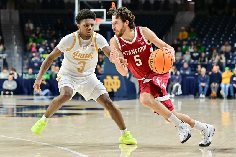 Mar 5, 2025; South Bend, Indiana, USA; Stanford Cardinal guard Benny Gealer (5) drives to the basket as Notre Dame Fighting Irish guard Markus Burton (3) defends in the second half at the Purcell Pavilion. Mandatory Credit: Matt Cashore-Imagn Images