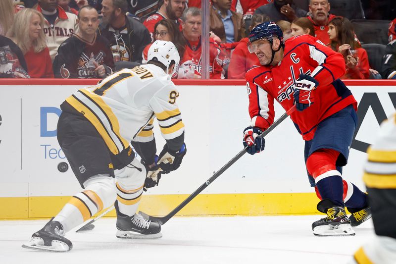 Oct 8, 2025; Washington, District of Columbia, USA; Washington Capitals left wing Alex Ovechkin (8) shoots the puck as Boston Bruins defenseman Nikita Zadorov (91) defends during the third period at Capital One Arena. Mandatory Credit: Geoff Burke-Imagn Images