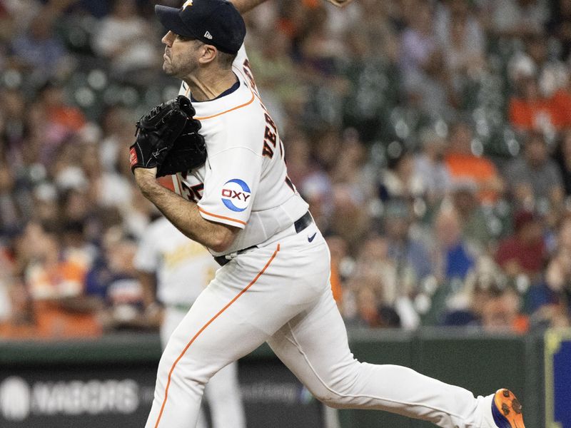 Sep 12, 2023; Houston, Texas, USA Houston Astros starting pitcher Justin Verlander (35) pitches against the Oakland Athletics in the first inning at Minute Maid Park. Mandatory Credit: Thomas Shea-USA TODAY Sports