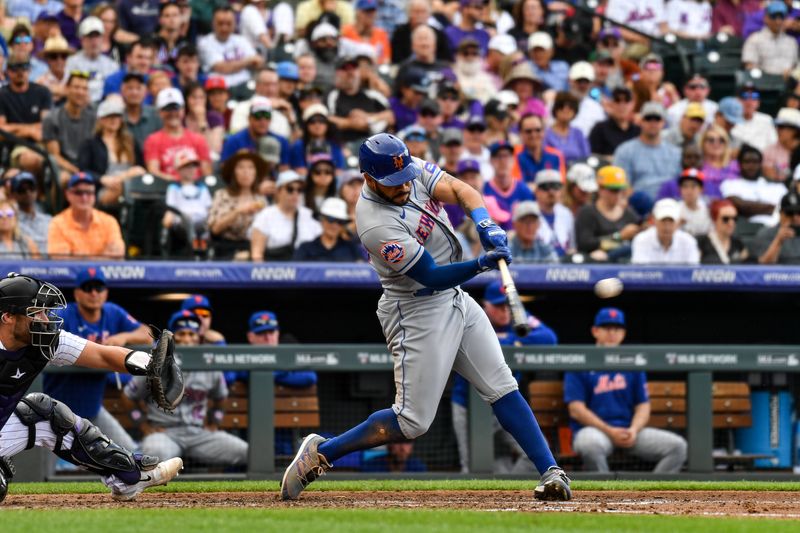 May 28, 2023; Denver, Colorado, USA; New York Mets left fielder Tommy Pham (28) hits a two run RBI for a double in the fourth inning against the Colorado Rockies at Coors Field. Mandatory Credit: John Leyba-USA TODAY Sports