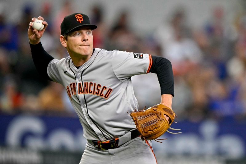 Jun 8, 2024; Arlington, Texas, USA; San Francisco Giants starting pitcher Spencer Howard (56) throws out Texas Rangers center fielder Leody Taveras (not pictured) at first base during the fifth inning at Globe Life Field. Mandatory Credit: Jerome Miron-USA TODAY Sports