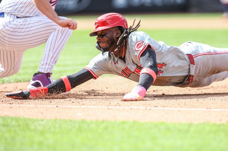 Sep 8, 2024; New York City, New York, USA;  Cincinnati Reds shortstop Elly De La Cruz (44) dives back to first base during a pick off attempt in the sixth inning against the New York Mets at Citi Field. Mandatory Credit: Wendell Cruz-Imagn Images