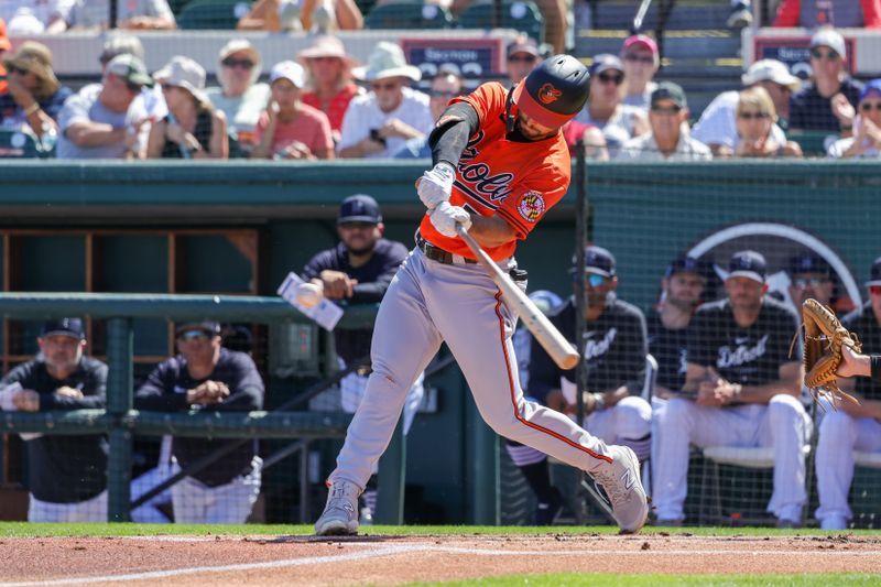 Feb 26, 2023; Lakeland, Florida, USA; Baltimore Orioles second baseman Terrin Vavra (77) hits a double during the first inning against the Detroit Tigers at Publix Field at Joker Marchant Stadium. Mandatory Credit: Mike Watters-USA TODAY Sports