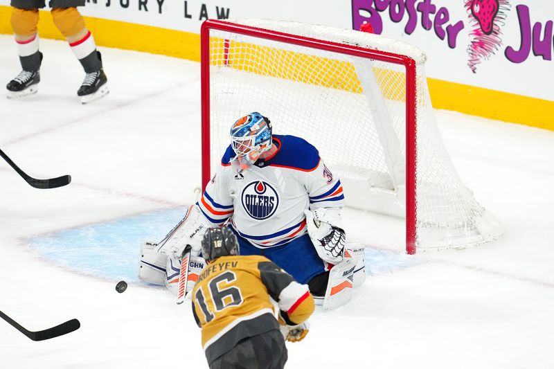Apr 1, 2025; Las Vegas, Nevada, USA; Edmonton Oilers goaltender Calvin Pickard (30) makes a save against Vegas Golden Knights left wing Pavel Dorofeyev (16) late in the third period at T-Mobile Arena. Mandatory Credit: Stephen R. Sylvanie-Imagn Images