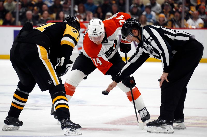 Feb 25, 2024; Pittsburgh, Pennsylvania, USA;  Pittsburgh Penguins center Evgeni Malkin (71) and Philadelphia Flyers right wing Owen Tippett (74) take a face-off during the third period at PPG Paints Arena. Pittsburgh won 7-6. Mandatory Credit: Charles LeClaire-USA TODAY Sports