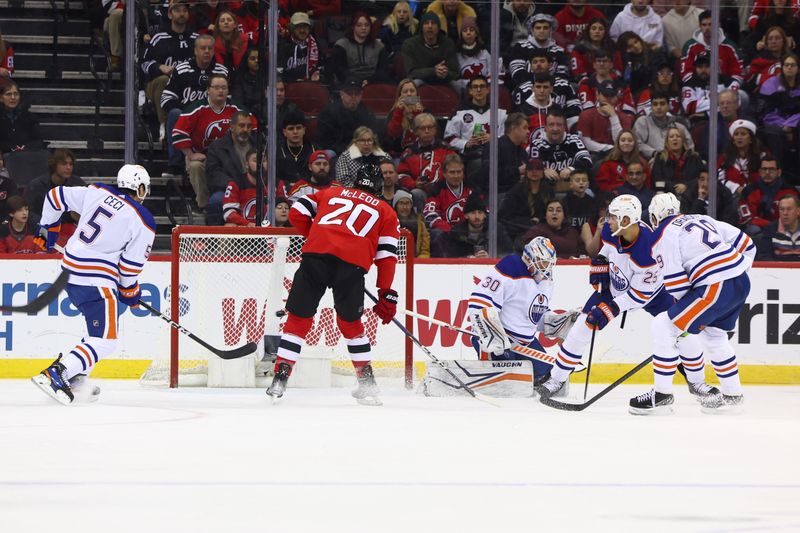 Dec 21, 2023; Newark, New Jersey, USA; New Jersey Devils center Dawson Mercer (91) (not shown) scores a goal against the Edmonton Oilers during the first period at Prudential Center. Mandatory Credit: Ed Mulholland-USA TODAY Sports