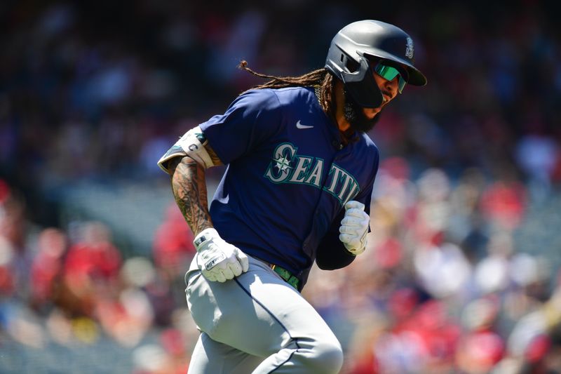 Jul 14, 2024; Anaheim, California, USA; Seattle Mariners shortstop J.P. Crawford (3) reacts after hitting a solo home run against the Los Angeles Angels during the sixth inning at Angel Stadium. Mandatory Credit: Gary A. Vasquez-USA TODAY Sports