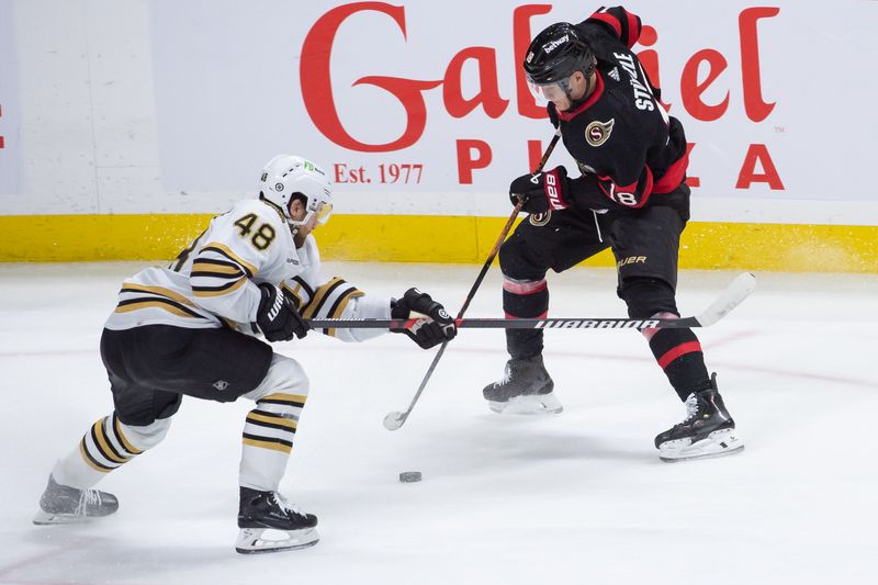 Jan 25, 2024; Ottawa, Ontario, CAN; Boston Bruins defenseman Matt Grzelcyk (48) battles with Ottawa Senators center Tim Stutzle (18) in the third period at the Canadian Tire Centre. Mandatory Credit: Marc DesRosiers-USA TODAY Sports