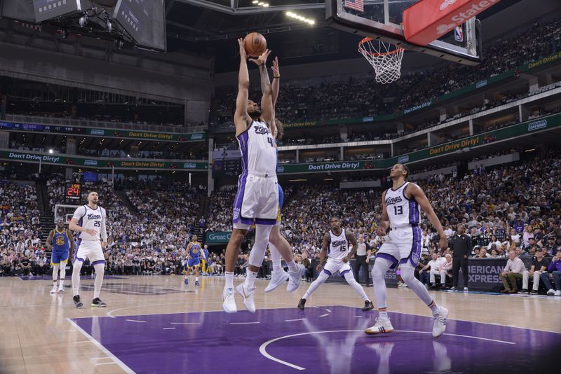 SACRAMENTO, CA - APRIL 16: Trey Lyles #41 of the Sacramento Kings rebounds the ball during the game against the Golden State Warriors during the 2024 Play-In Tournament on April 16, 2024 at Golden 1 Center in Sacramento, California. NOTE TO USER: User expressly acknowledges and agrees that, by downloading and or using this Photograph, user is consenting to the terms and conditions of the Getty Images License Agreement. Mandatory Copyright Notice: Copyright 2024 NBAE (Photo by Rocky Widner/NBAE via Getty Images)