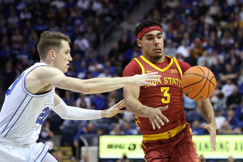 Jan 16, 2024; Provo, Utah, USA; Brigham Young Cougars guard Spencer Johnson (20) and Iowa State Cyclones guard Tamin Lipsey (3) follow a loose ball during the second half at Marriott Center. Mandatory Credit: Rob Gray-USA TODAY Sports