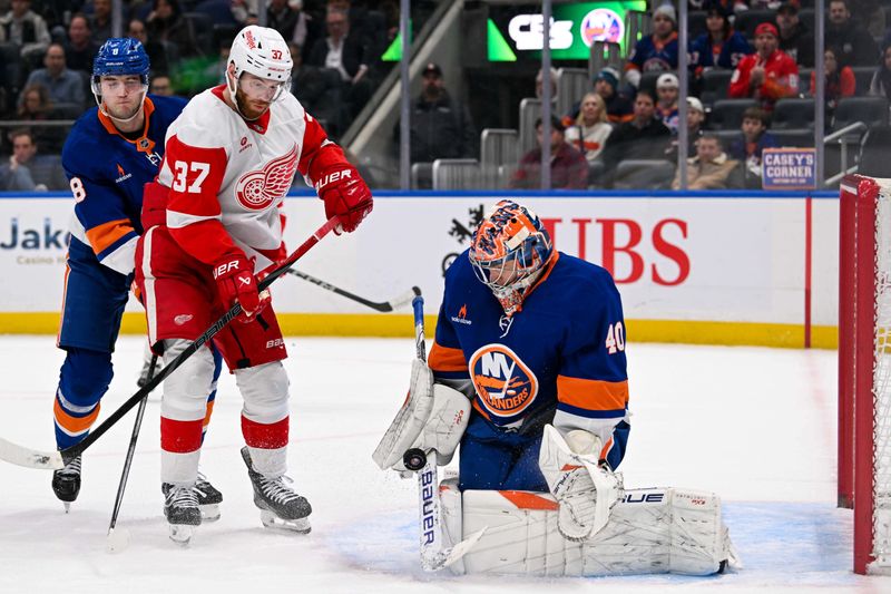 Nov 25, 2024; Elmont, New York, USA;  New York Islanders goaltender Semyon Varlamov (40) makes a save against the Detroit Red Wings during the second period at UBS Arena. Mandatory Credit: Dennis Schneidler-Imagn Images
