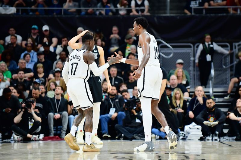 AUSTIN, TX - MARCH 17: Day'Ron Sharpe #20 of the Brooklyn Nets high fives Dennis Schroder #17 during the game against the San Antonio Spurs on March 17, 2024 at the Moody Center in Austin, Texas. NOTE TO USER: User expressly acknowledges and agrees that, by downloading and or using this photograph, user is consenting to the terms and conditions of the Getty Images License Agreement. Mandatory Copyright Notice: Copyright 2024 NBAE (Photos by Michael Gonzales/NBAE via Getty Images)