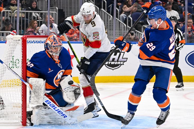 Oct 26, 2024; Elmont, New York, USA;  New York Islanders goaltender Semyon Varlamov (40) makes a save against the Florida Panthers during the third period at UBS Arena. Mandatory Credit: Dennis Schneidler-Imagn Images