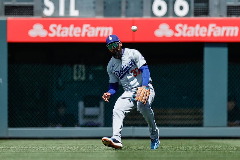 Jun 20, 2024; Denver, Colorado, USA; Los Angeles Dodgers right fielder Teoscar Hernandez (37) fields a hit in the fifth inning against the Colorado Rockies at Coors Field. Mandatory Credit: Isaiah J. Downing-USA TODAY Sports