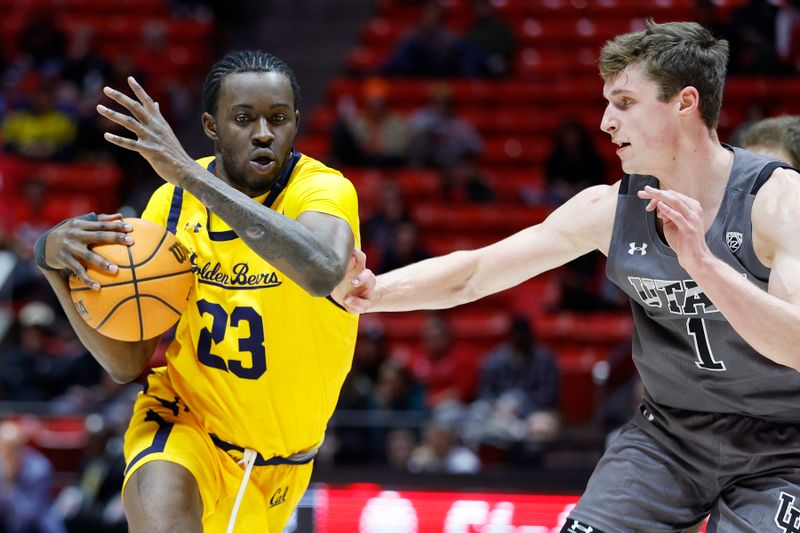 Feb 5, 2023; Salt Lake City, Utah, USA; California Golden Bears forward Obinna Anyanwu (23) drives against Utah Utes forward Ben Carlson (1) in the first half at Jon M. Huntsman Center. Mandatory Credit: Jeffrey Swinger-USA TODAY Sports