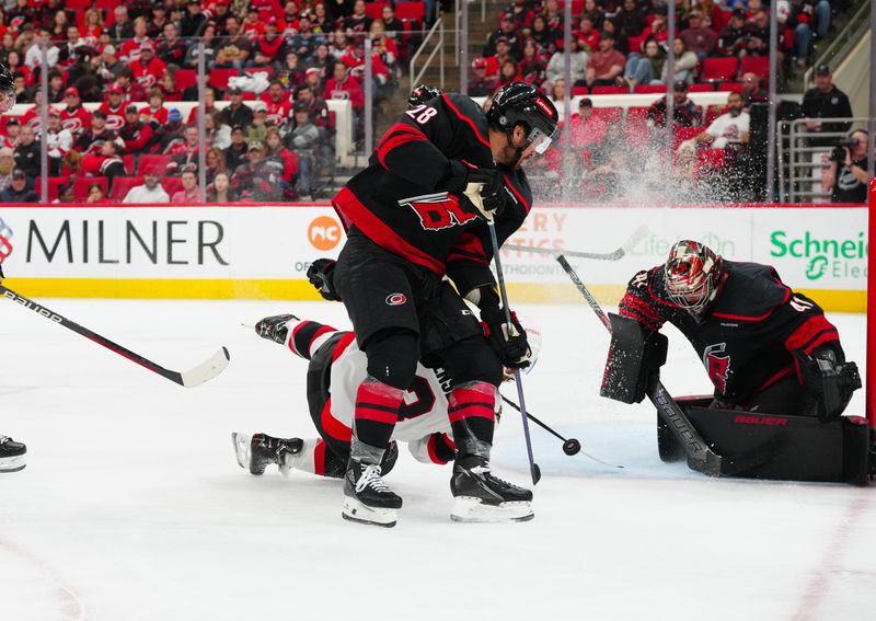 Nov 16, 2024; Raleigh, North Carolina, USA;  Ottawa Senators defenseman Nick Jensen (3) scoring attempt stopped by Carolina Hurricanes goaltender Spencer Martin (41) and left wing William Carrier (28) during the second period at Lenovo Center. Mandatory Credit: James Guillory-Imagn Images