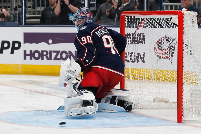 Feb 10, 2024; Columbus, Ohio, USA; Columbus Blue Jackets goalie Elvis Merzlikins (90) makes a pad save against the Tampa Bay Lightning during the third period at Nationwide Arena. Mandatory Credit: Russell LaBounty-USA TODAY Sports