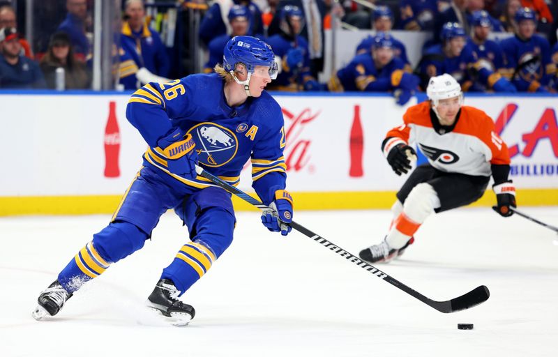 Apr 5, 2024; Buffalo, New York, USA;  Buffalo Sabres defenseman Rasmus Dahlin (26) skates with the puck during the first period against the Philadelphia Flyers at KeyBank Center. Mandatory Credit: Timothy T. Ludwig-USA TODAY Sports