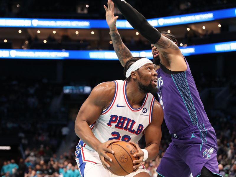 CHARLOTTE, NC - DECEMBER 3: Guerschon Yabusele #28 of the Philadelphia 76ers handles the ball during the game against the Charlotte Hornets during an NBA Emirates Cup game on December 3, 2024 at Spectrum Center in Charlotte, North Carolina. NOTE TO USER: User expressly acknowledges and agrees that, by downloading and or using this photograph, User is consenting to the terms and conditions of the Getty Images License Agreement. Mandatory Copyright Notice: Copyright 2024 NBAE (Photo by Brock Williams-Smith/NBAE via Getty Images)