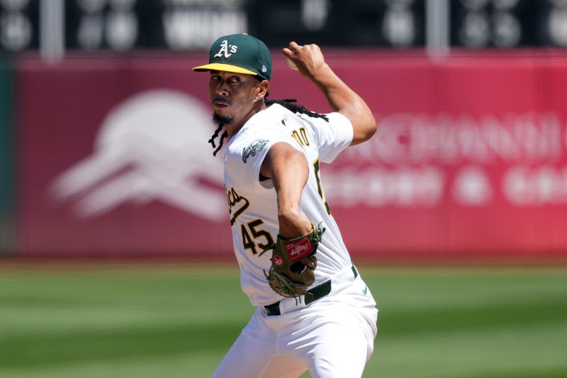 Aug 4, 2024; Oakland, California, USA; Oakland Athletics starting pitcher Osvaldo Bido (45) throws a pitch against the Los Angeles Dodgers during the fourth inning at Oakland-Alameda County Coliseum. Mandatory Credit: Darren Yamashita-USA TODAY Sports