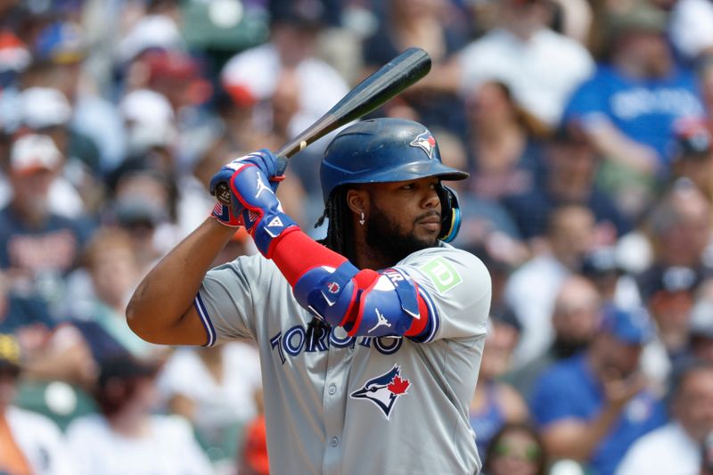 May 25, 2024; Detroit, Michigan, USA; Toronto Blue Jays first baseman Vladimir Guerrero Jr. (27) looks on during an at bat in the first inning of the game against the the Detroit Tigers at Comerica Park. Mandatory Credit: Brian Bradshaw Sevald-USA TODAY Sports