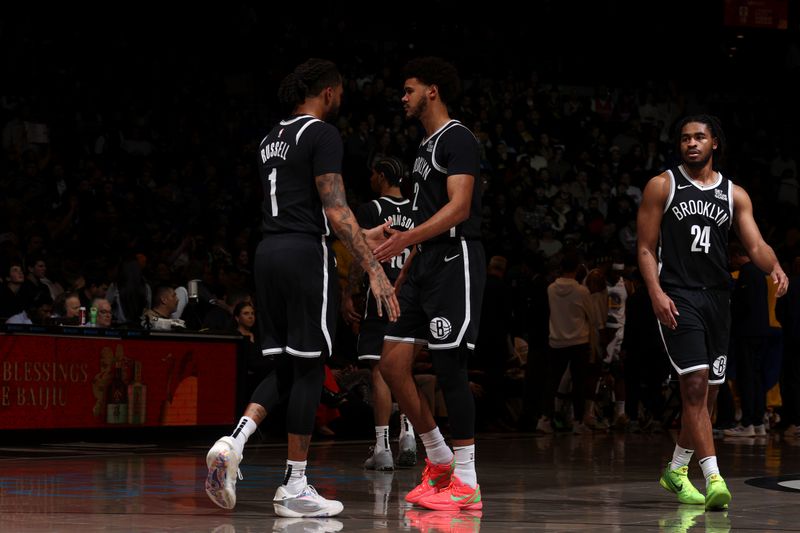 BROOKLYN, NY - MARCH 6: D'Angelo Russell #1 and Cameron Johnson #2 of the Brooklyn Nets high five during the game against the Golden State Warriors on March 6, 2025 at Barclays Center in Brooklyn, New York. NOTE TO USER: User expressly acknowledges and agrees that, by downloading and or using this Photograph, user is consenting to the terms and conditions of the Getty Images License Agreement. Mandatory Copyright Notice: Copyright 2025 NBAE(Photo by Nathaniel S. Butler/NBAE via Getty Images)