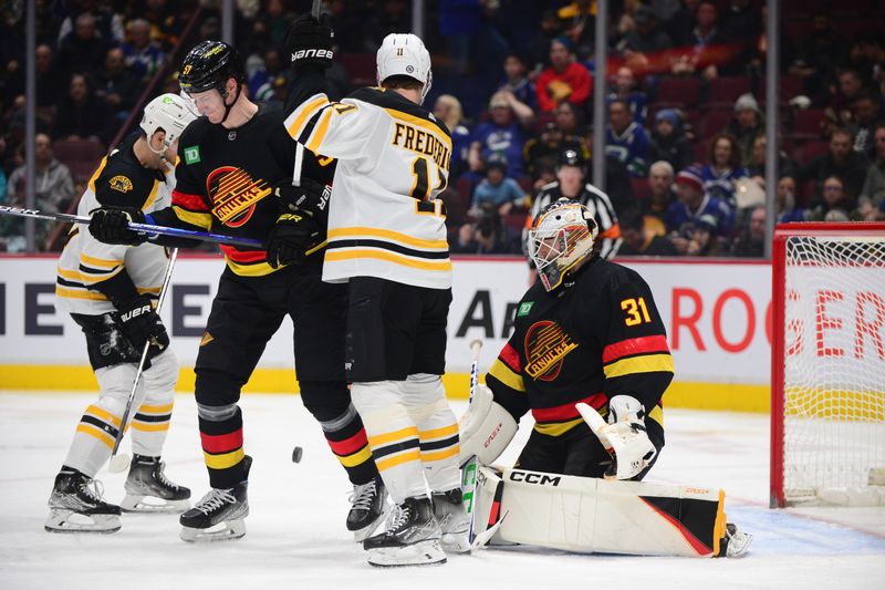 Feb 25, 2023; Vancouver, British Columbia, CAN; Vancouver Canucks goaltender Arturs Silovs (31) blocks a shot on net by the Boston Bruins during the second period at Rogers Arena. Mandatory Credit: Anne-Marie Sorvin-USA TODAY Sports