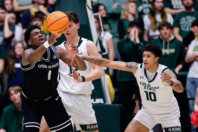 Feb 17, 2024; Fort Collins, Colorado, USA; Utah State Aggies forward Great Osobor (1) and Colorado State Rams guard Nique Clifford (10) battle for the ball in the second half at Moby Arena. Mandatory Credit: Isaiah J. Downing-USA TODAY Sports