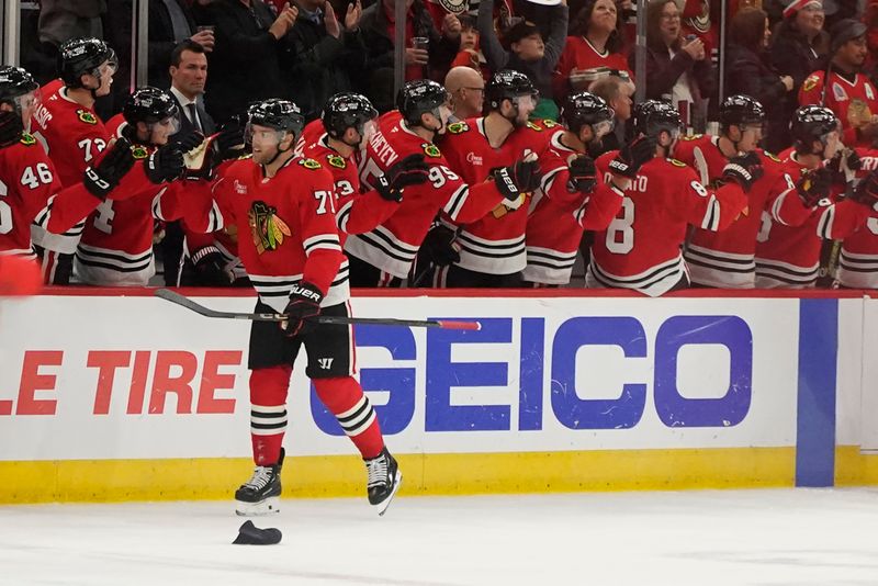 Nov 27, 2024; Chicago, Illinois, USA; Chicago Blackhawks left wing Taylor Hall (71) celebrates his hat trick against the Dallas Stars during the second period at United Center. Mandatory Credit: David Banks-Imagn Images