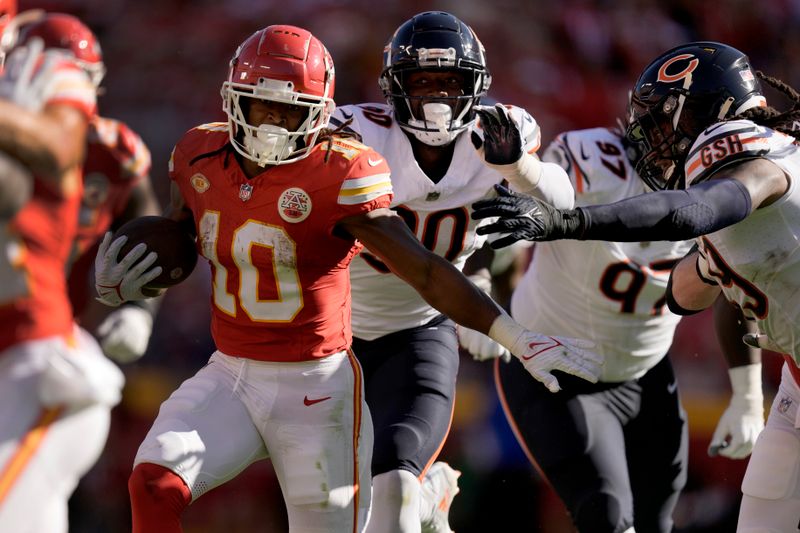 Kansas City Chiefs running back Isiah Pacheco (10) runs for a first down during the first half of an NFL football game against the Chicago Bears Sunday, Sept. 24, 2023, in Kansas City, Mo. (AP Photo/Charlie Riedel)