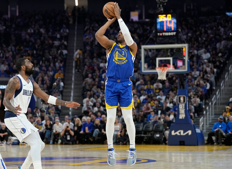 SAN FRANCISCO, CALIFORNIA - APRIL 02: Chris Paul #3 of the Golden State Warriors shoots a three-point shot over Kyrie Irving #11 of the Dallas Mavericks during the first half of an NBA basketball game at Chase Center on April 02, 2024 in San Francisco, California. NOTE TO USER: User expressly acknowledges and agrees that, by downloading and or using this photograph, User is consenting to the terms and conditions of the Getty Images License Agreement. (Photo by Thearon W. Henderson/Getty Images)