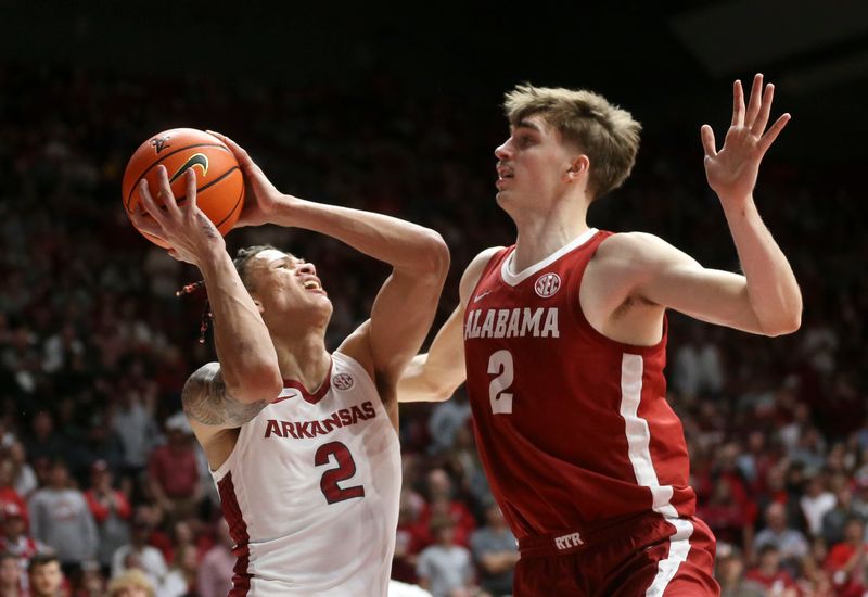 Mar 9, 2024; Tuscaloosa, Alabama, USA;  Arkansas forward Trevon Brazile (2) shoots with Alabama forward Grant Nelson (2) defending at Coleman Coliseum. Alabama came from behind to win on overtime 92-88. Mandatory Credit: Gary Cosby Jr.-USA TODAY Sports